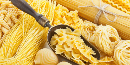retro still life with assortment of uncooked pasta